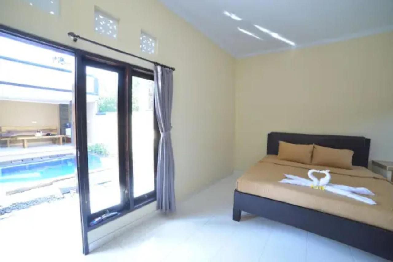 Oyo Flagship 91237 Ratu Guest House Kedunganan Kültér fotó